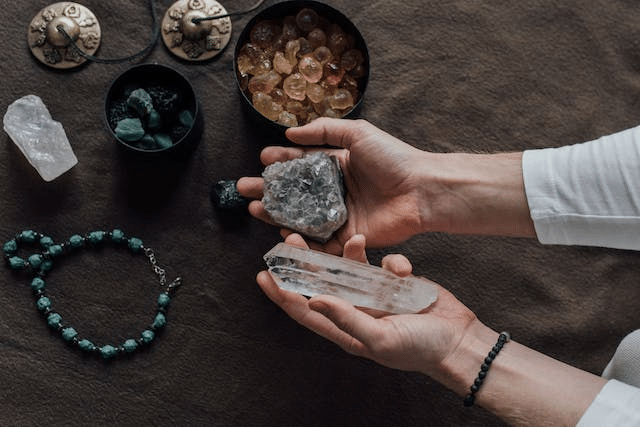 a person holding healing crystals