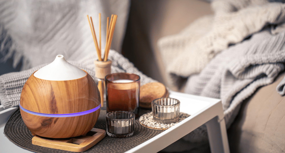 cozy-composition-with-aroma-diffuser-candles-home-interior